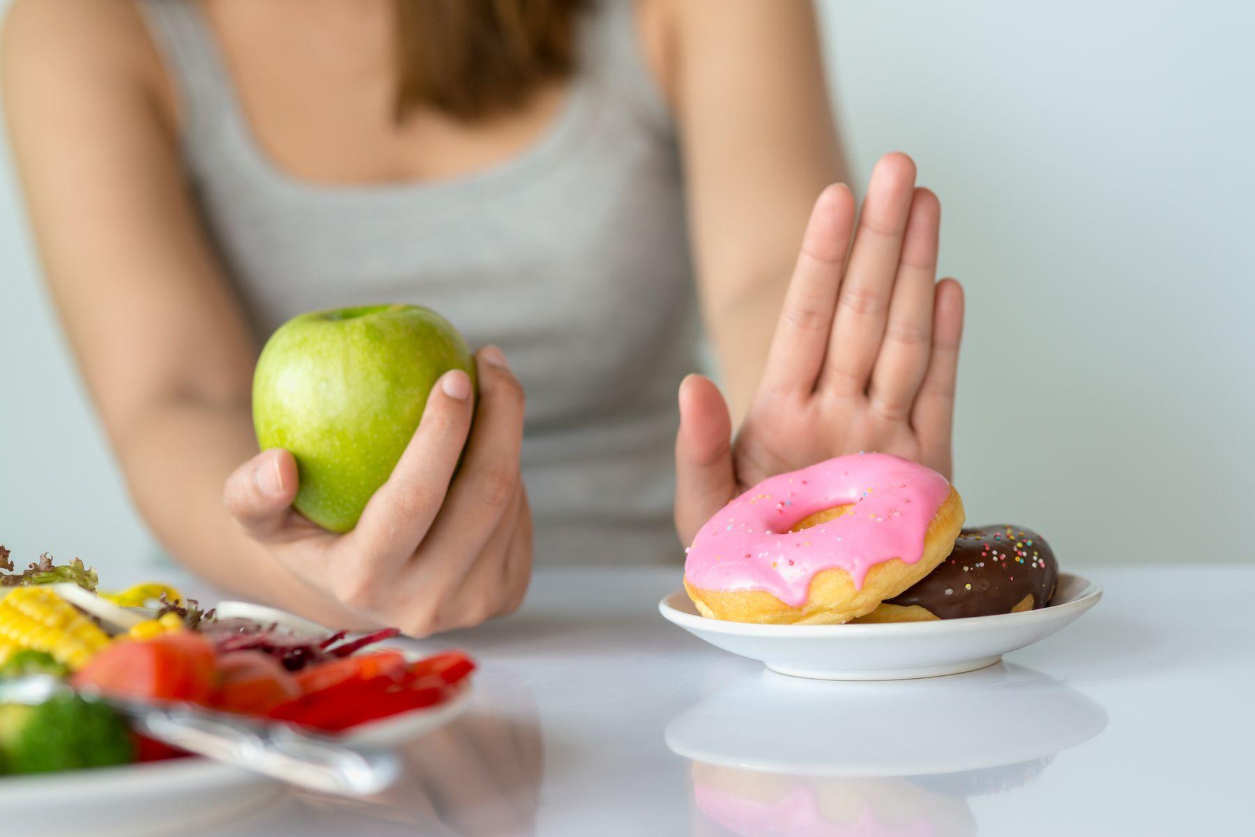 Physical, psychological, and societal factors make us eat more sugar than ever. Learn how to beat sugar cravings with these 5 strategies.